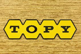 Topy Industries signboard and logo